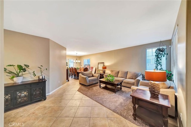 tiled living room with a chandelier