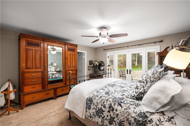 bedroom featuring access to outside, ceiling fan, light carpet, and french doors