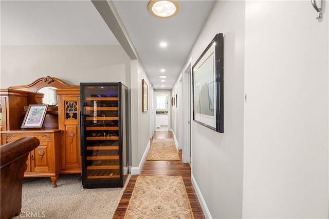 hallway featuring wine cooler and hardwood / wood-style floors