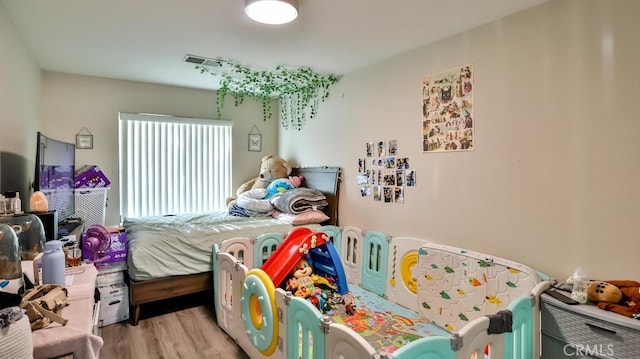 bedroom featuring light wood-type flooring