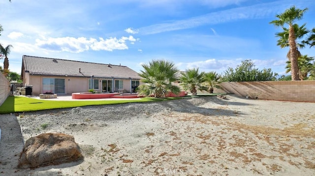 rear view of house featuring a patio area