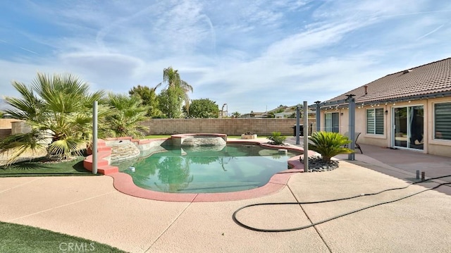 view of swimming pool featuring an in ground hot tub and a patio