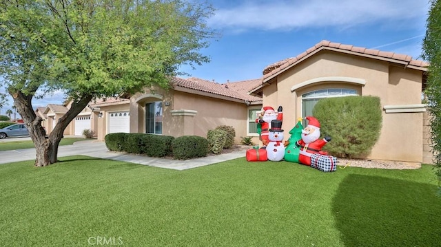 view of front of house with a front lawn and a garage