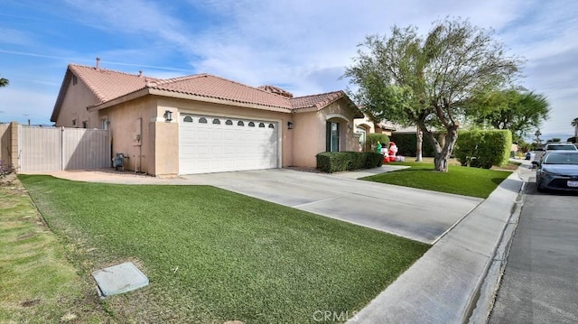 view of front of house with a garage and a front lawn