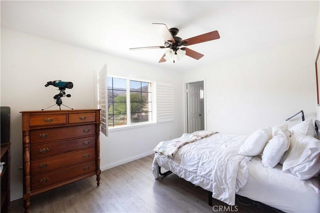 bedroom featuring hardwood / wood-style floors and ceiling fan