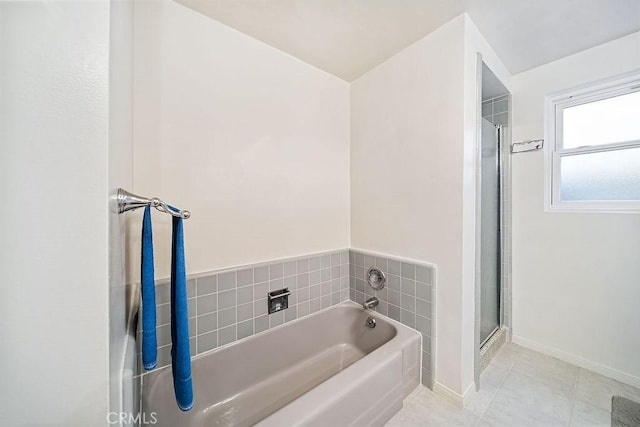 bathroom with tile patterned flooring and plus walk in shower