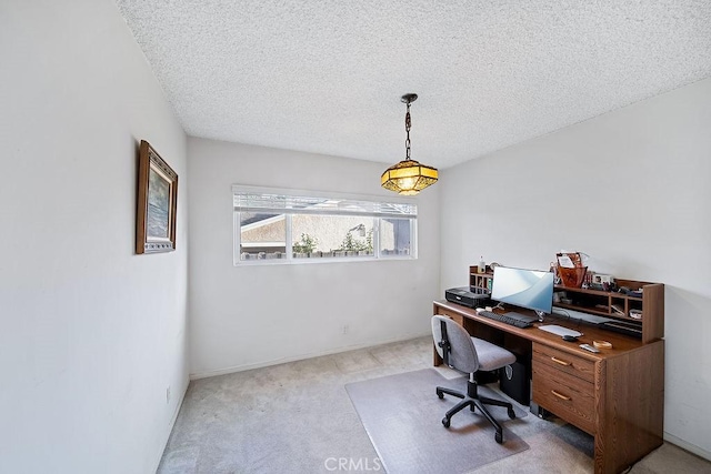 office with light colored carpet and a textured ceiling