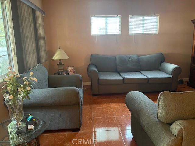 living room with tile patterned floors