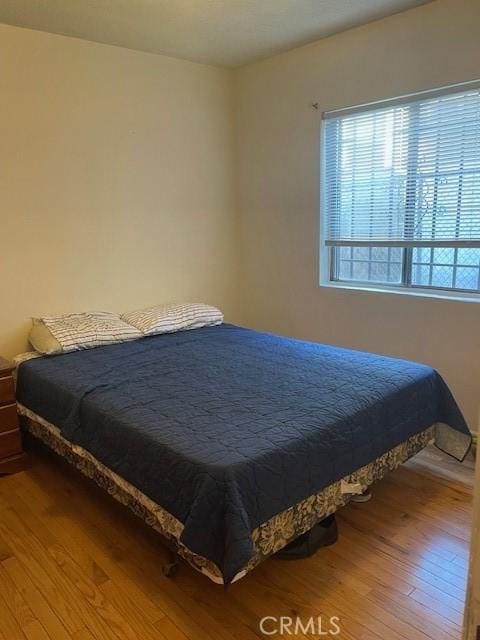 bedroom featuring wood-type flooring