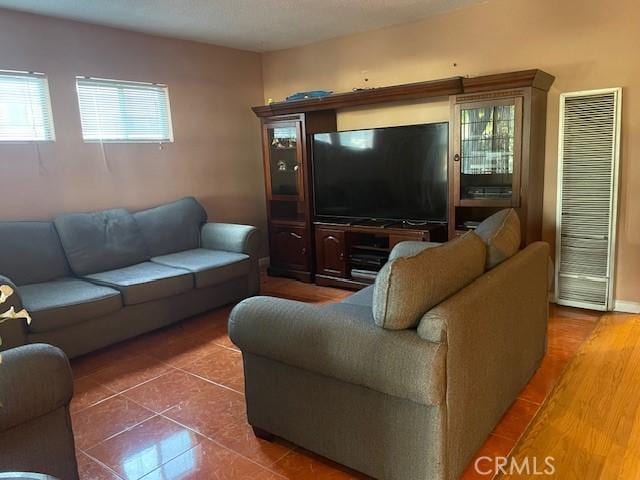 living room featuring dark tile patterned flooring