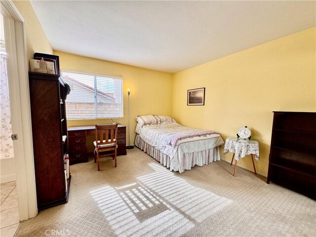 carpeted bedroom with baseboards