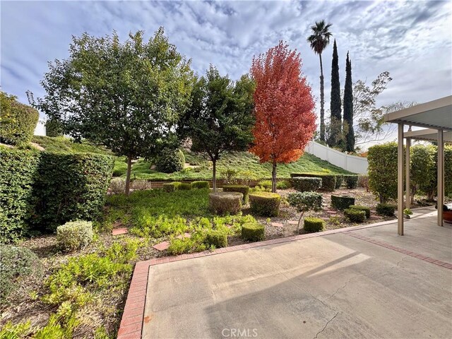 view of patio / terrace featuring fence