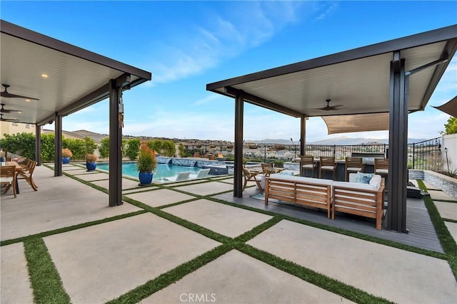 view of patio featuring an outdoor hangout area and ceiling fan