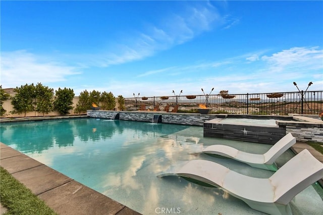 view of swimming pool featuring pool water feature