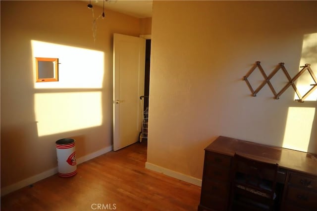 corridor featuring light hardwood / wood-style floors