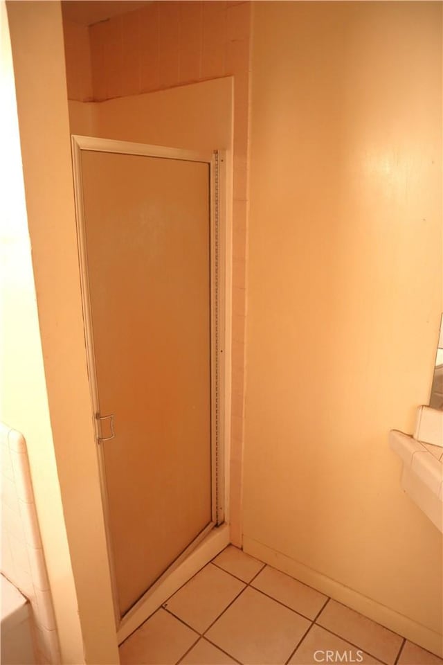 bathroom with tile patterned floors