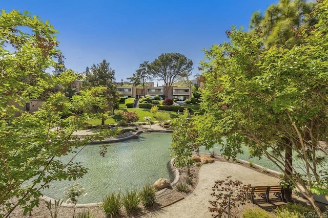 surrounding community featuring a water view