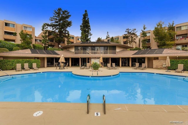 view of swimming pool with a patio