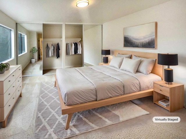 bedroom with light colored carpet