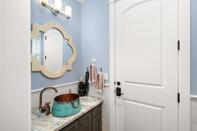 bathroom featuring tasteful backsplash and vanity