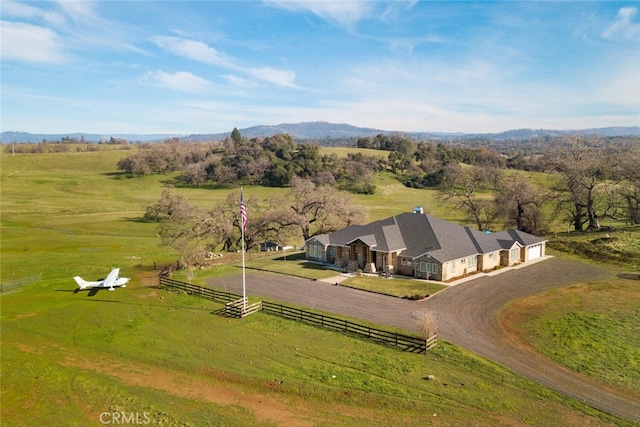 birds eye view of property featuring a mountain view and a rural view