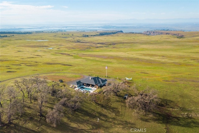 birds eye view of property with a rural view