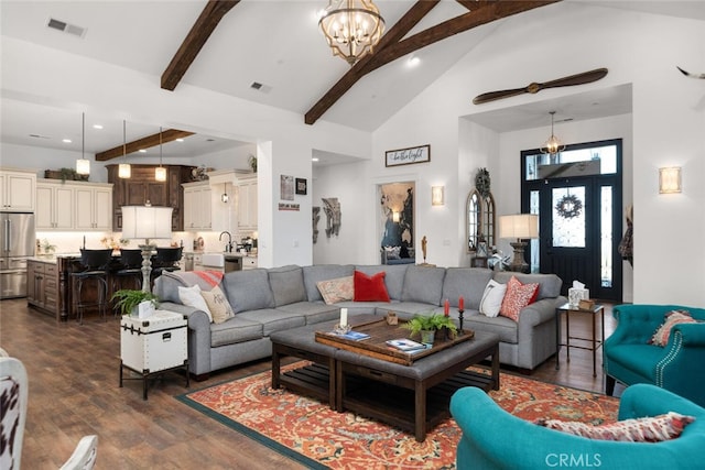 living room featuring beam ceiling, a chandelier, high vaulted ceiling, and dark wood-type flooring