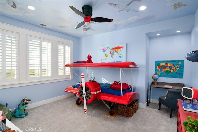 recreation room with ceiling fan and light colored carpet