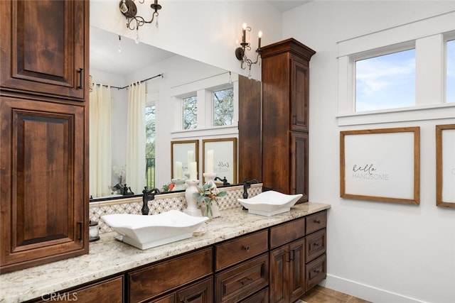 bathroom featuring vanity and plenty of natural light