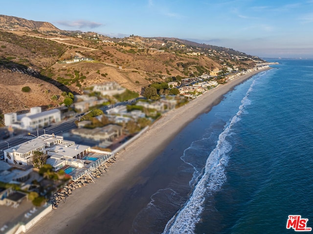 aerial view featuring a beach view and a water and mountain view