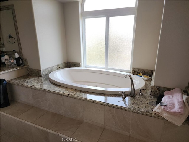 bathroom with tiled tub