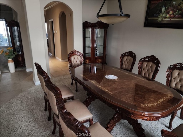 dining space with light tile patterned flooring