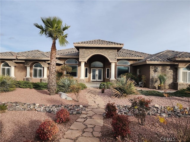 mediterranean / spanish home with french doors