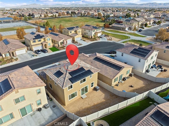 birds eye view of property featuring a mountain view