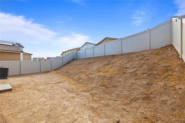 view of yard featuring central AC unit