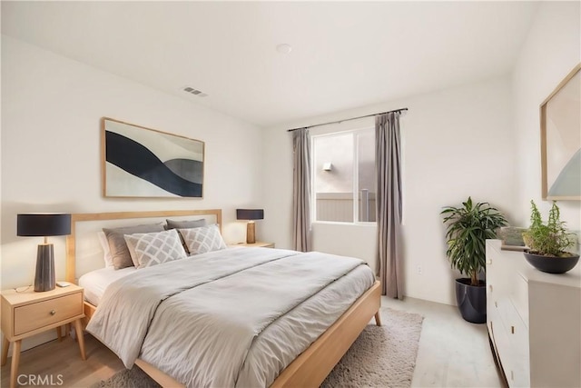 bedroom with light colored carpet