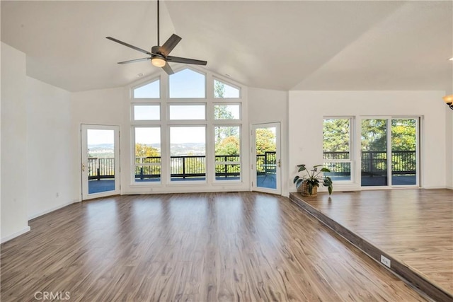 interior space with hardwood / wood-style flooring, ceiling fan, and a healthy amount of sunlight