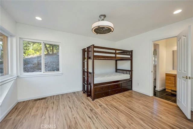 unfurnished bedroom with light hardwood / wood-style flooring