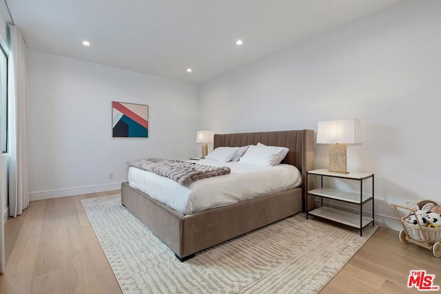 bedroom with light hardwood / wood-style flooring