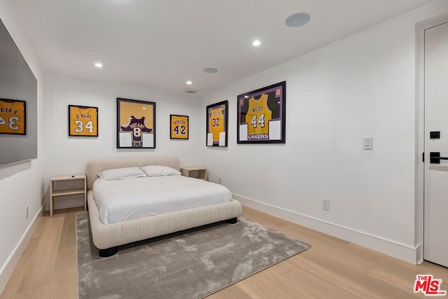 bedroom with light hardwood / wood-style flooring