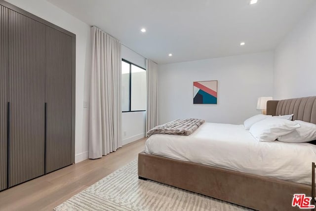 bedroom with light wood-type flooring