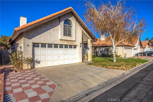 view of front facade featuring a front yard and a garage