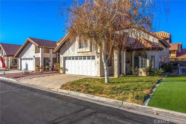 view of front of home featuring a garage and a front yard