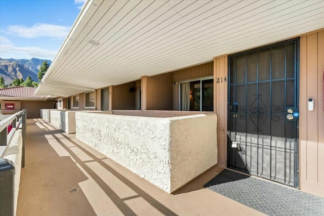 exterior space with a mountain view and a balcony