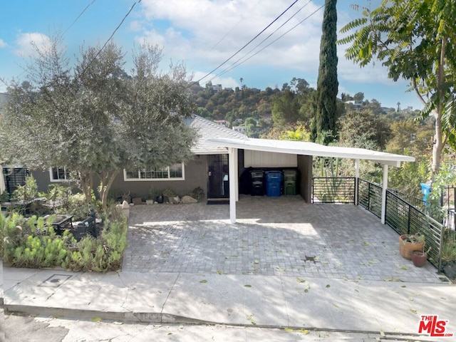 view of front of home featuring a carport