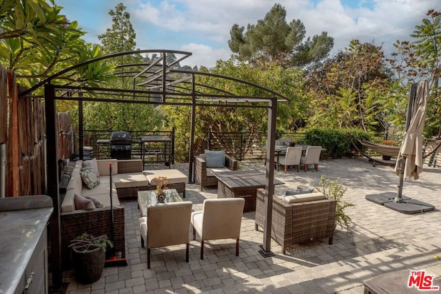 view of patio / terrace featuring an outdoor hangout area and grilling area