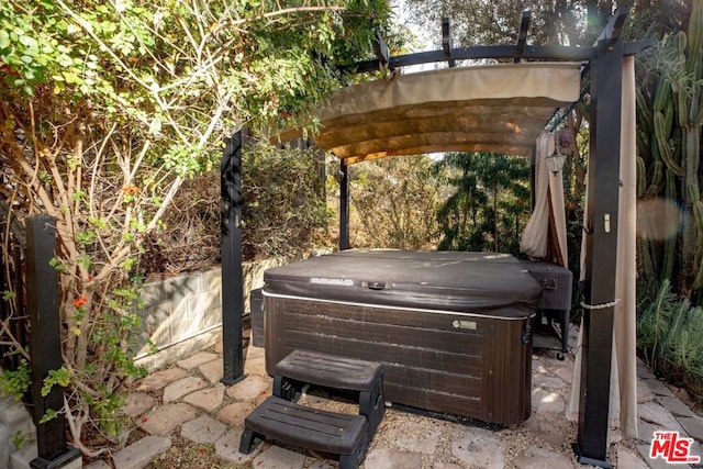 view of patio with a hot tub