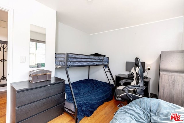 bedroom with wood-type flooring