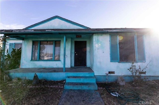 view of front of property featuring covered porch