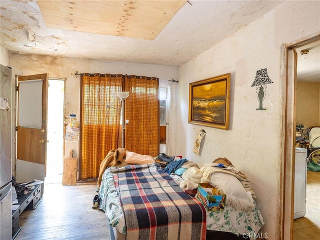 bedroom with wood-type flooring